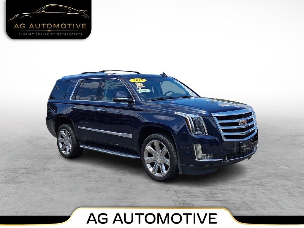 2019 Cadillac Escalade Luxury in Dark Adriatic Blue Metallic — front three-quarter view